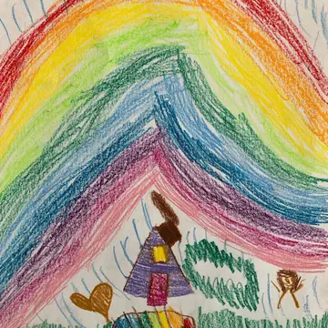 Olivia's crayon drawing of a rainbow over a house